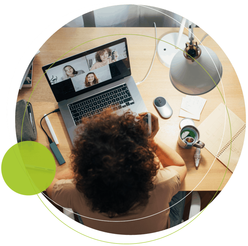 aerial view of woman at desk on a video call)