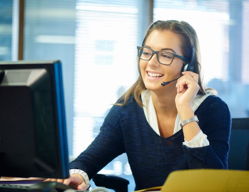 Woman with headset in call centre